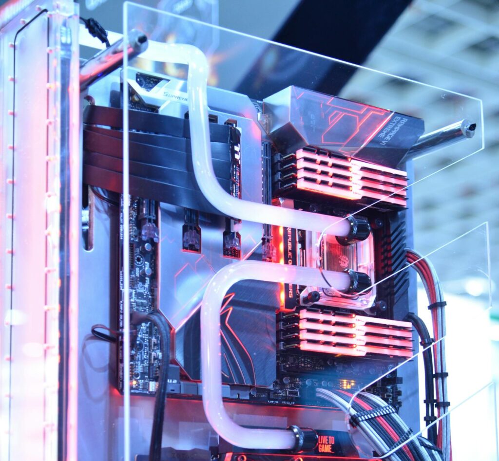 Close-up view of a custom gaming PC with water cooling and LED lights, highlighting advanced technology.
